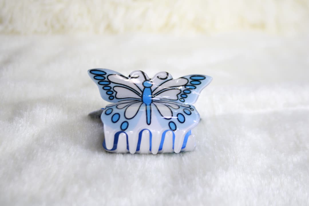 Pinza para cabello con diseño de mariposa
