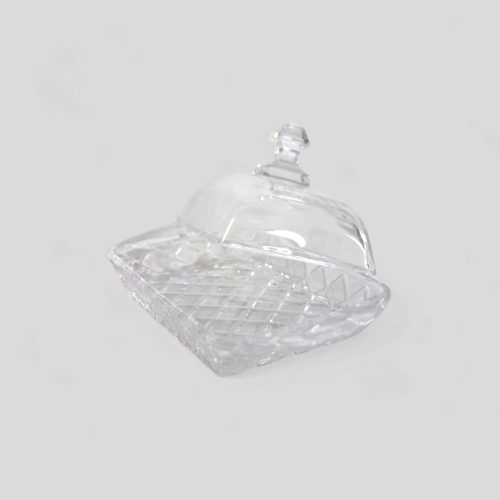 Mantequillera de vidrio con un diseño en relieve de rombos.